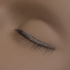 a close up of the lashes on a mannequin training head for lash extensions