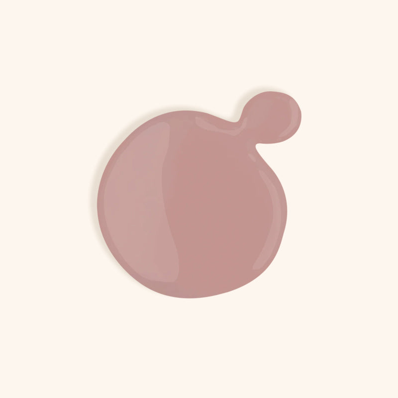Mauve nude gel nail polish shade against light background