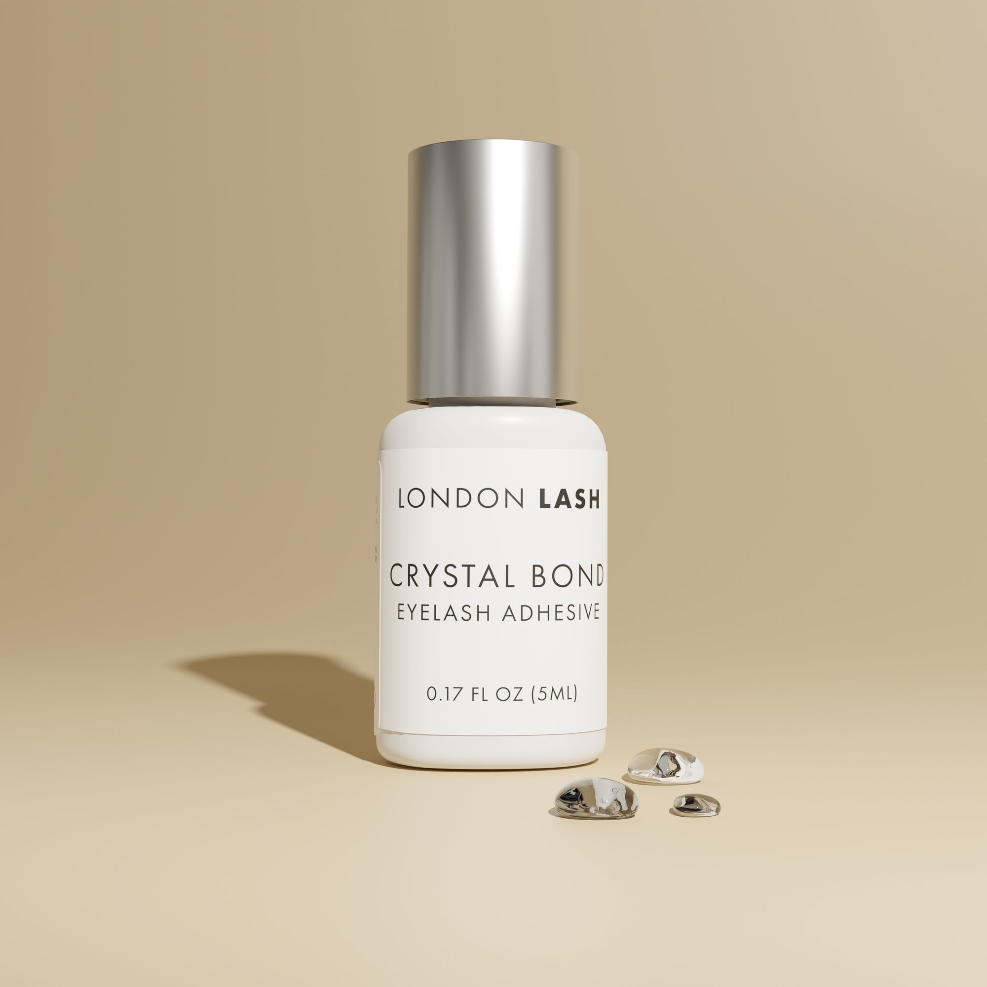 a bottle of london lash crystal bond clear lash glue