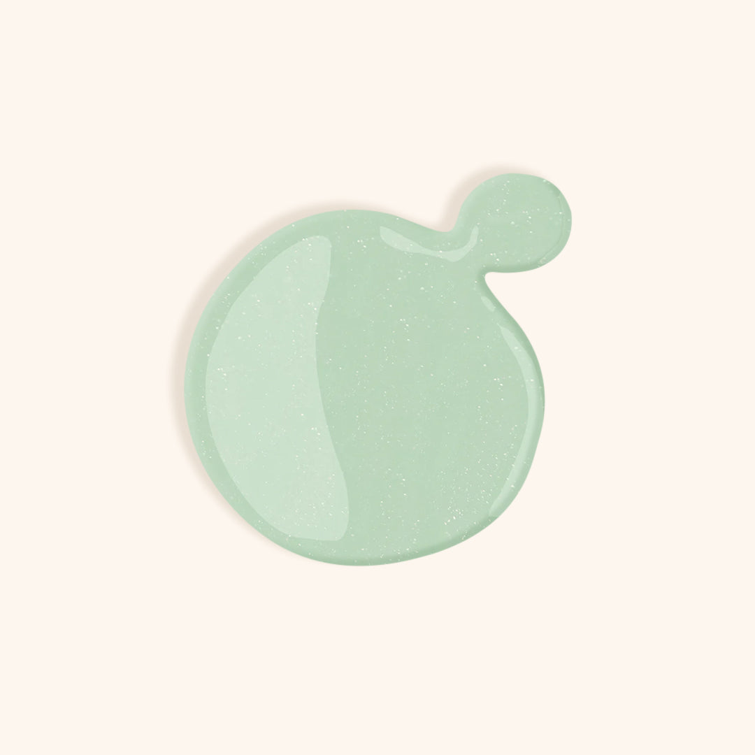 Light green gel nail polish with shimmer