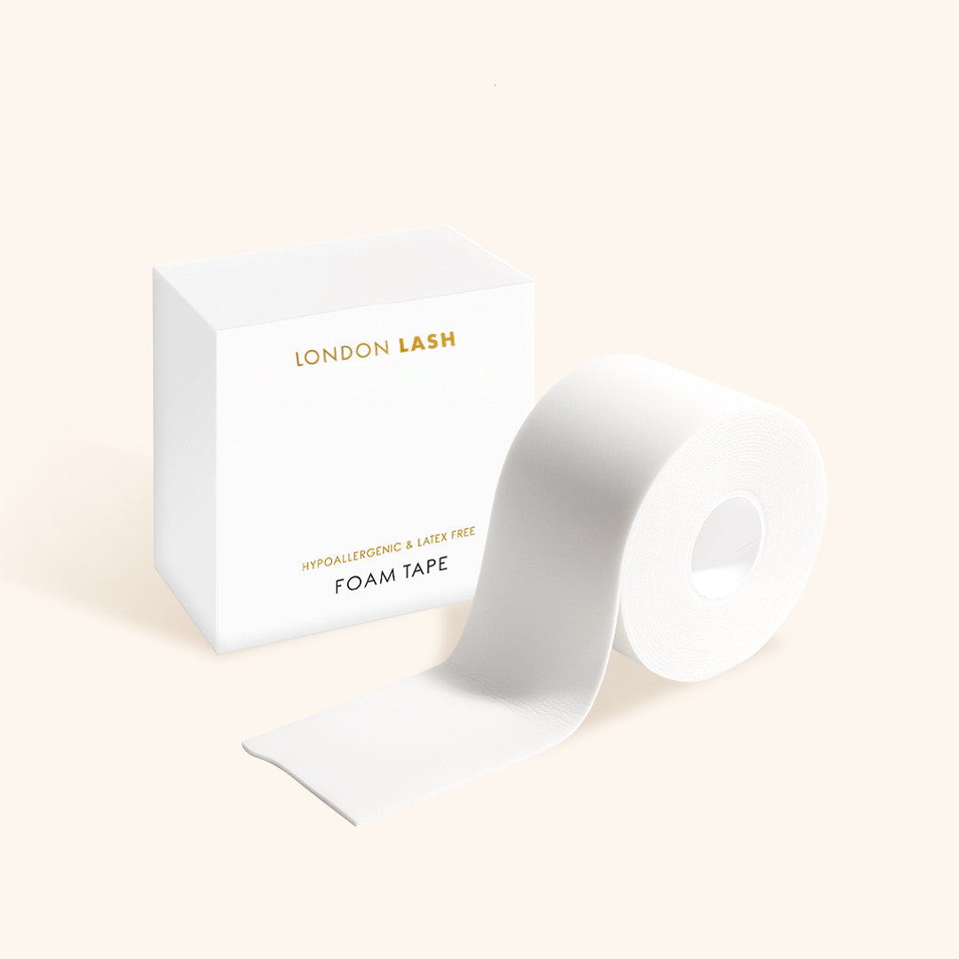 a roll of microfoam tape for eyelash extensions beside its box