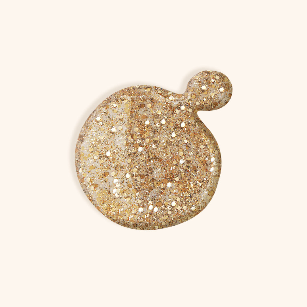 Gold glitter nail polish with a hint of rose gel nail polish