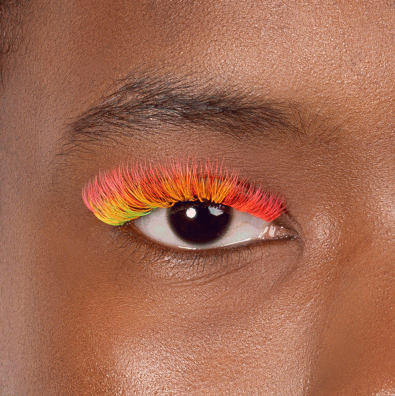 Orange and yellow neon lashes glowing under UV light