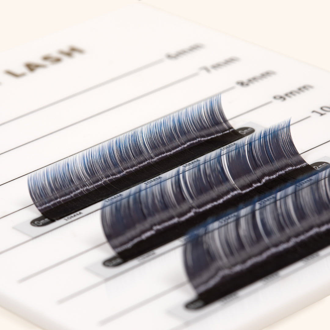 a close up of ombre lashes on a lash palette showing their blue tips