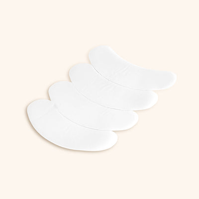 a sheet of teflon eyepatches for eyelash extensions with four eyepatches on it