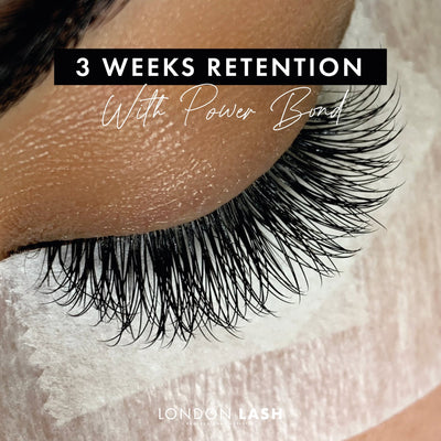 a close up of a set of lash extensions during a lash fill showing the retention after 3 weeks with power bond