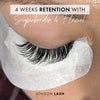 a close up of a set of eyelash extensions showing 4 weeks of lash retention with london lash superbonder and flexie lash glue