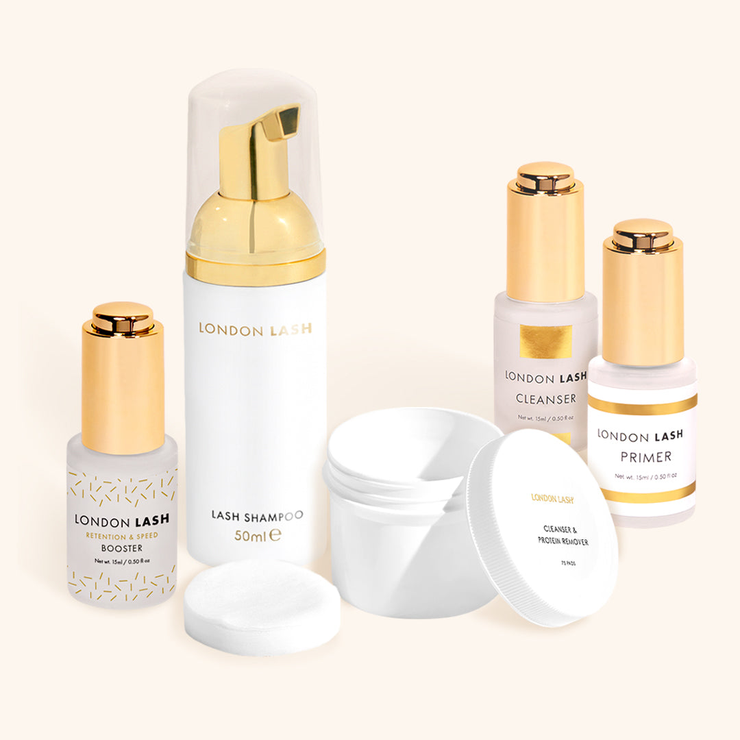 the london lash five step pretreatment routine. A bottle each of lash shampoo, booster, lash cleanser and lash primer , and a tub of protein pads are arranged in a group