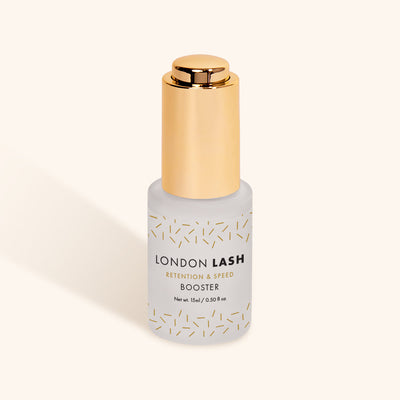 a bottle of london lash booster in a frosted glass bottle with a gold lid