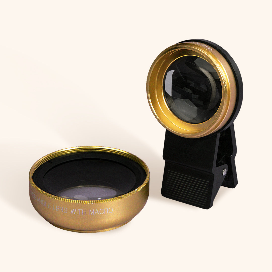 a close up of the clip on macro lens in gold with the wide angle lens attachment next to it