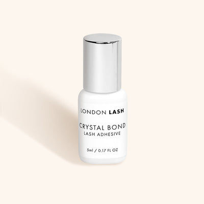 a bottle of london lash crystal bond clear lash glue