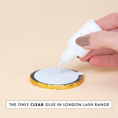 London Lash's clear lash glue Crystal Bond being applied to a jade stone