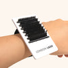 a small lash tile attached to the wrist