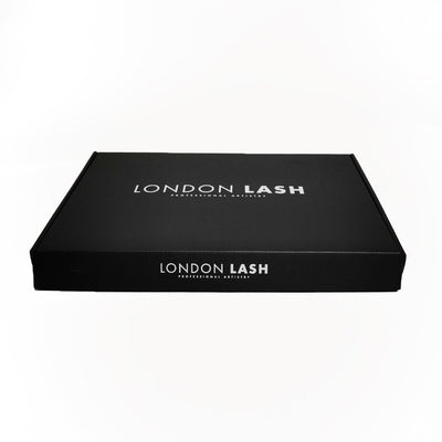 A box for lash extension kits. It is black and features the London Lash logo in white