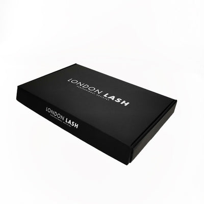 A box for lash extension kits. It is black and features the London Lash logo in white