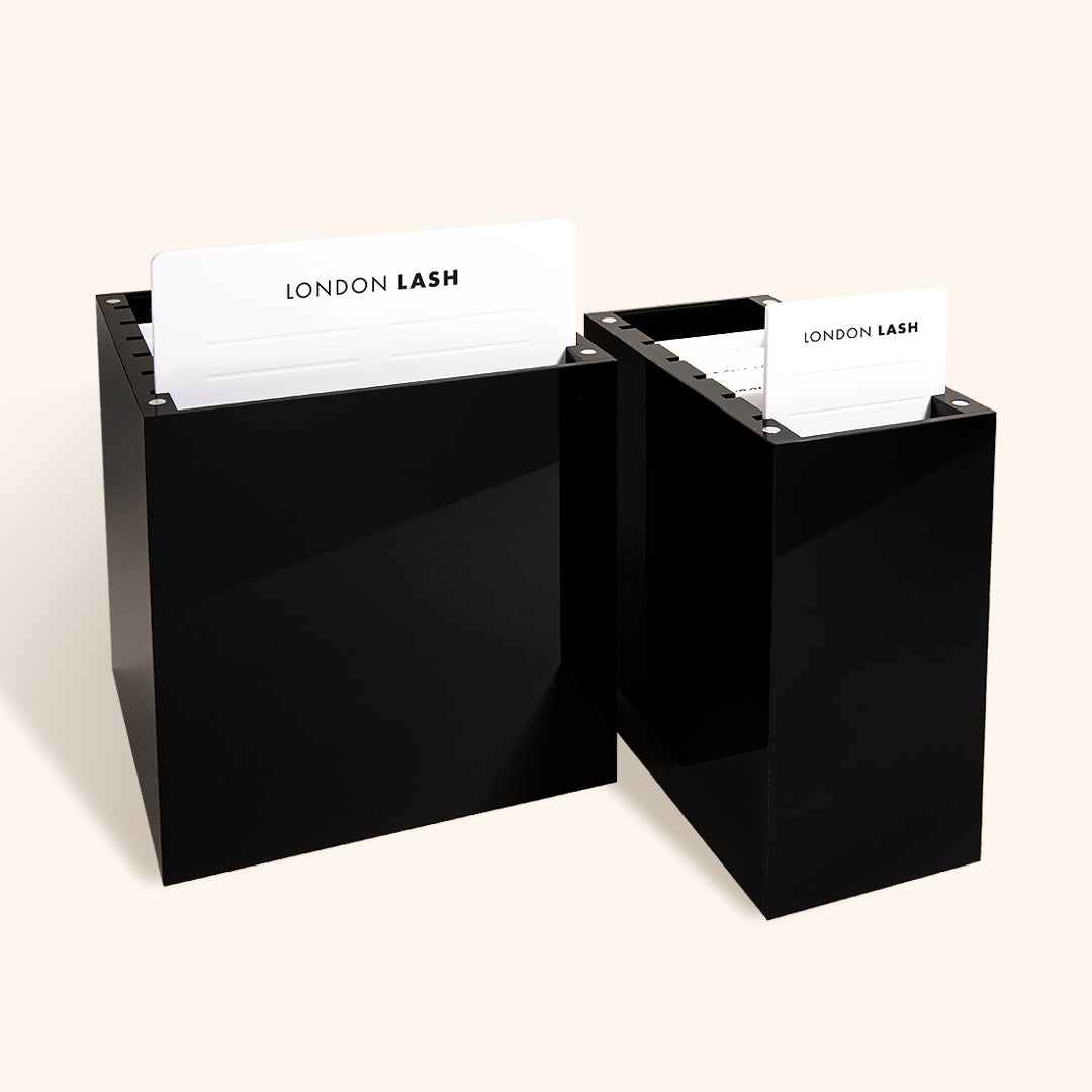 a large black lash palette organizer next to a small black palette organizer