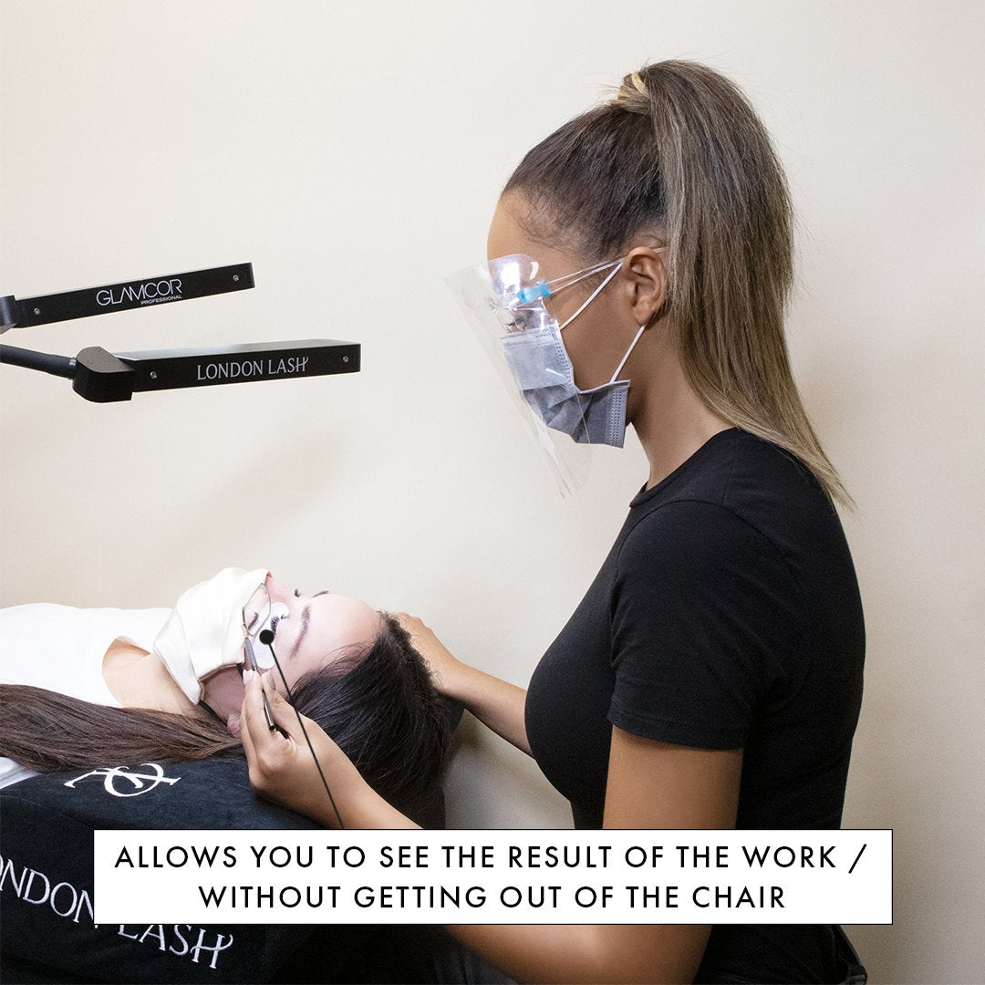 a lash mirror being used to check a set of lashes from underneath