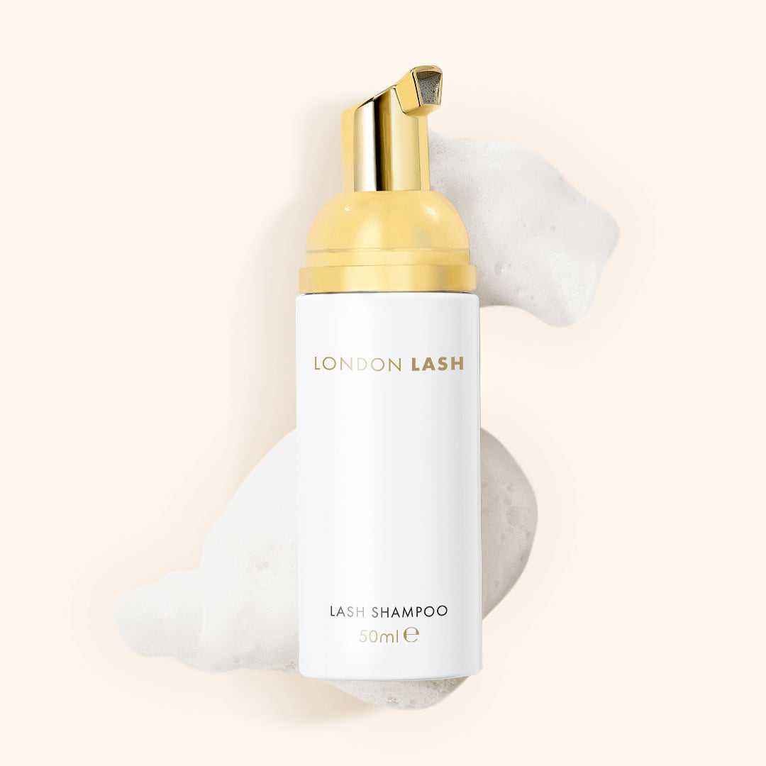 lash shampoo for eyelash extensions laying in some lash shampoo foam