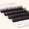 a close up of mayfair eyelash extensions showing the color and length of the lashes.