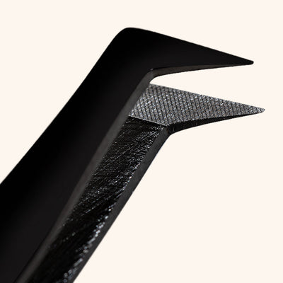 a close up of the tips of the london lash fiber grip volume lash tweezers showing the fiber grip on the inside of the boot