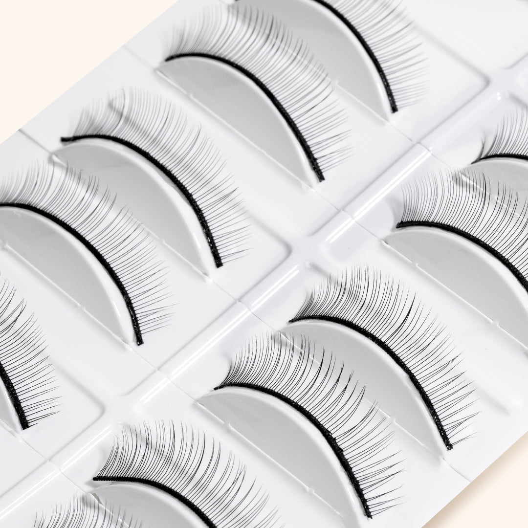 a close up of practice strip lashes in their box