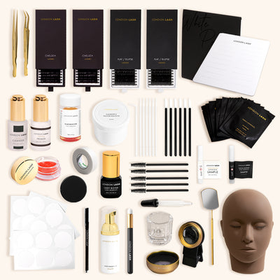 a flat lay of a large eyelash extensions kit for classic lashes with all the essentials for a training course