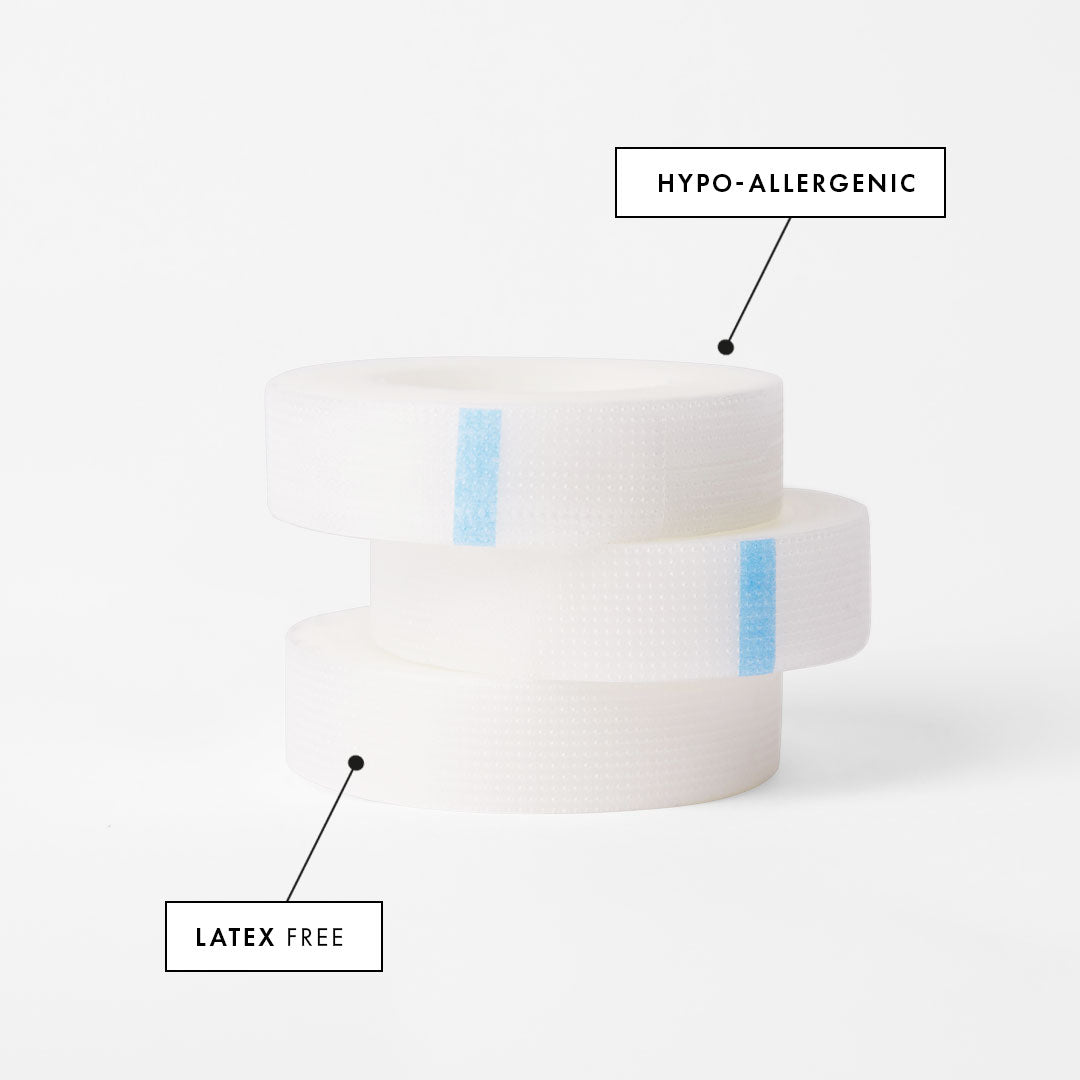 a stack of three rolls of perforated tape for eyelash extensions