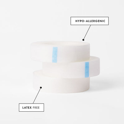 a stack of three rolls of perforated tape for eyelash extensions