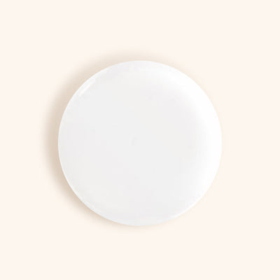 a round silicone pad used for creating volume lash fans