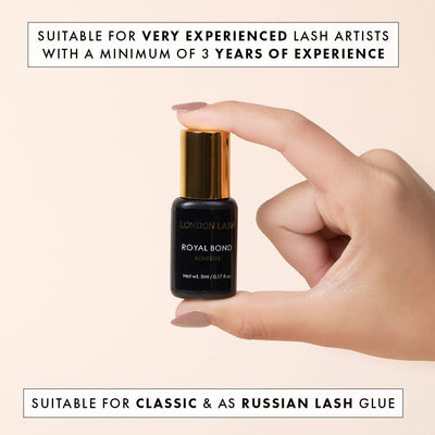 a full-sized bottle of royal bond lash glue being held up to show the packaging. there is text to say that it is for very advanced lash techs and can be used for both classic lashes and volume lashes