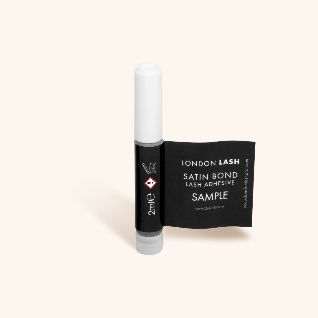 a sample-sized bottle of satin bond lash glue