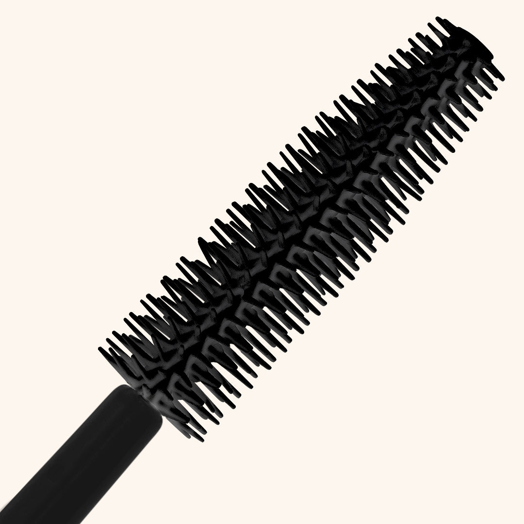 Close up of a black silicone mascara wand head