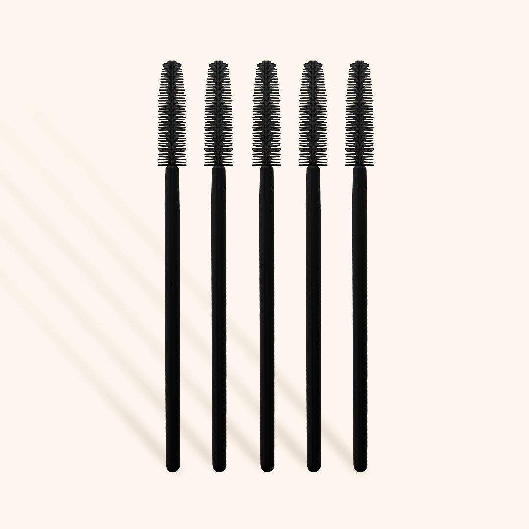 a row of five silicone mascara wands for brushing lash extensions