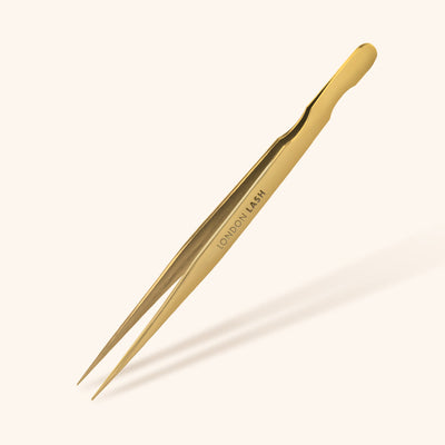 a pair of straight isolation tweezers for classic lash extensions in gold
