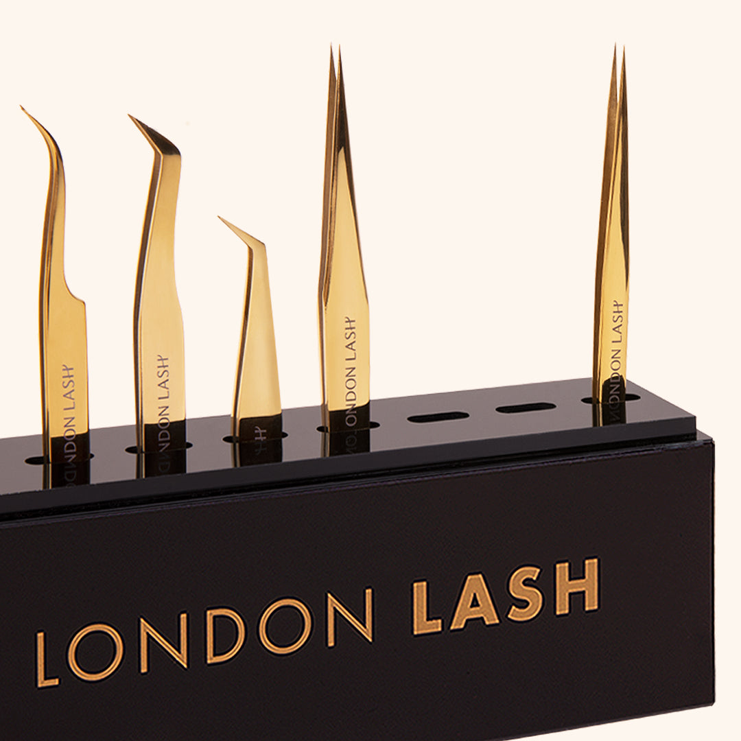 a close up of tweezer storage holding five different types of lash extension tweezers