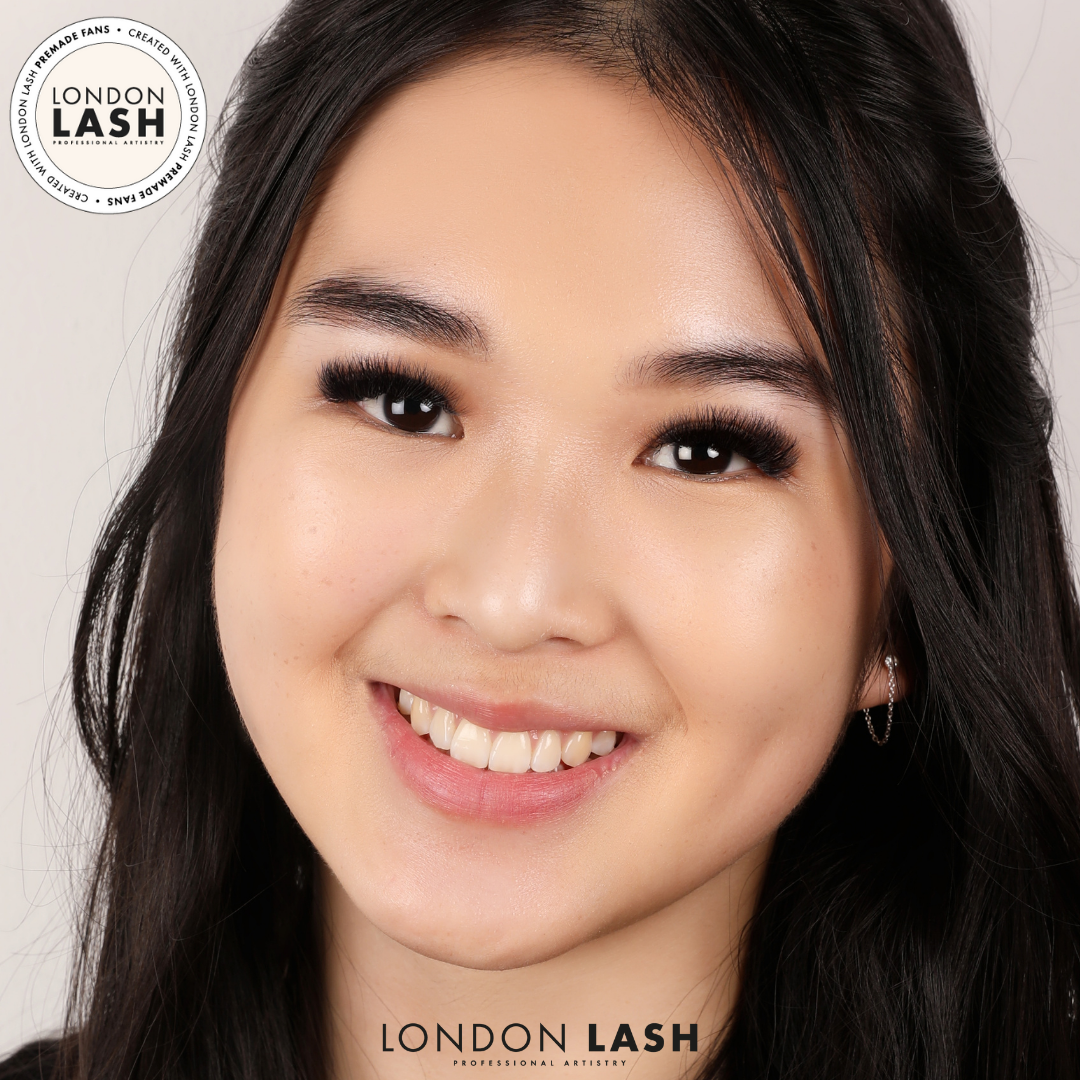 Dark haired client wearing eyelash extensions made with premade lash fans