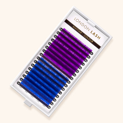 a box of colored lash extensions. half of the box is bright purple and half of the box is bright blue