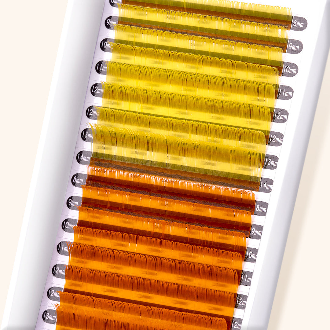 close up of yellow and orange colored lashes. 8 rows are bright yellow, and 8 rows are bright orange. 