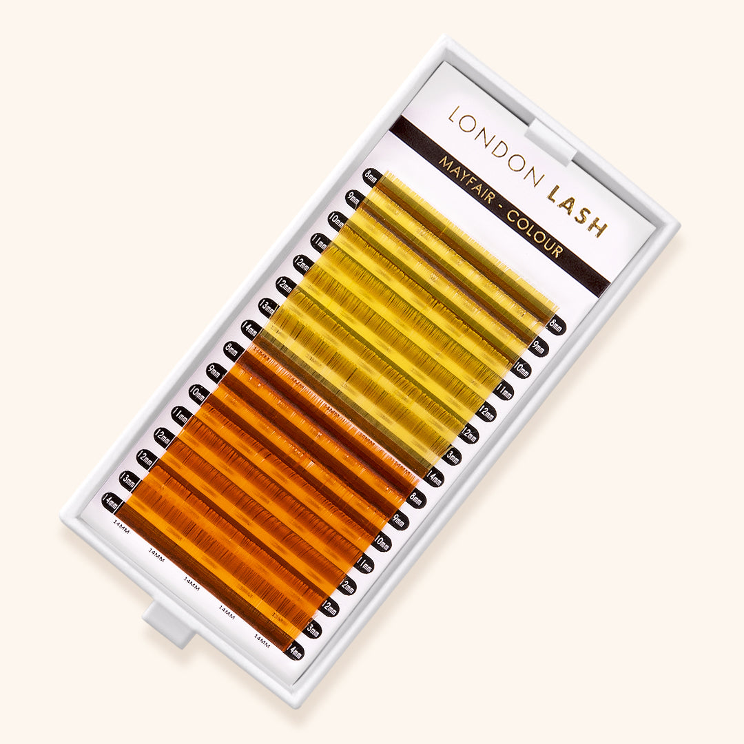 yellow and orange colored eyelash extensions in mixed lengths. 8 rows are a bright yellow, and the other 8 rows are a bright orange